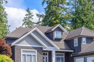 roofing services gray home with asphalt roof