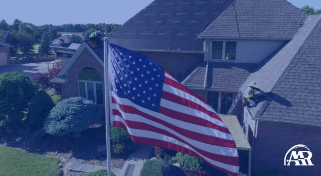 image with roof installation in background and American flag is flying in foreground and entire image is tinted blue