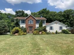 roofers ashland ohio home with shingle roof and vinyl siding