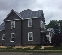 slate roofing Ashland Ohio house with black slate roof and gray siding installation