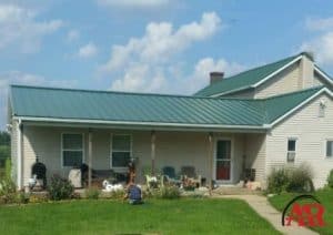 metal roofing mount vernon ohio home with green metal roof and gray siding