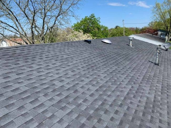 gray shingles on a new roof installation
