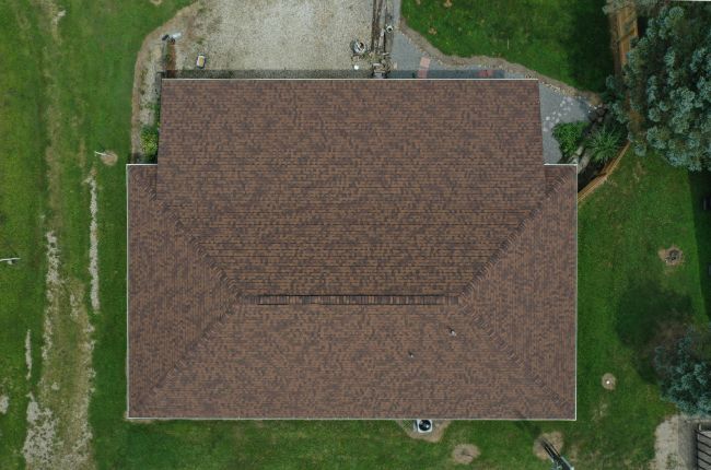 roofers near me installed sienna brown shingles on roof from elevated view