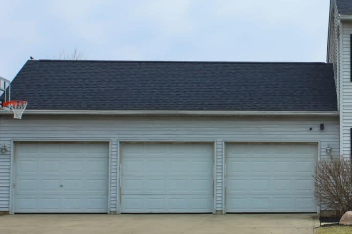 picture of new shingle roof installation over three car garage